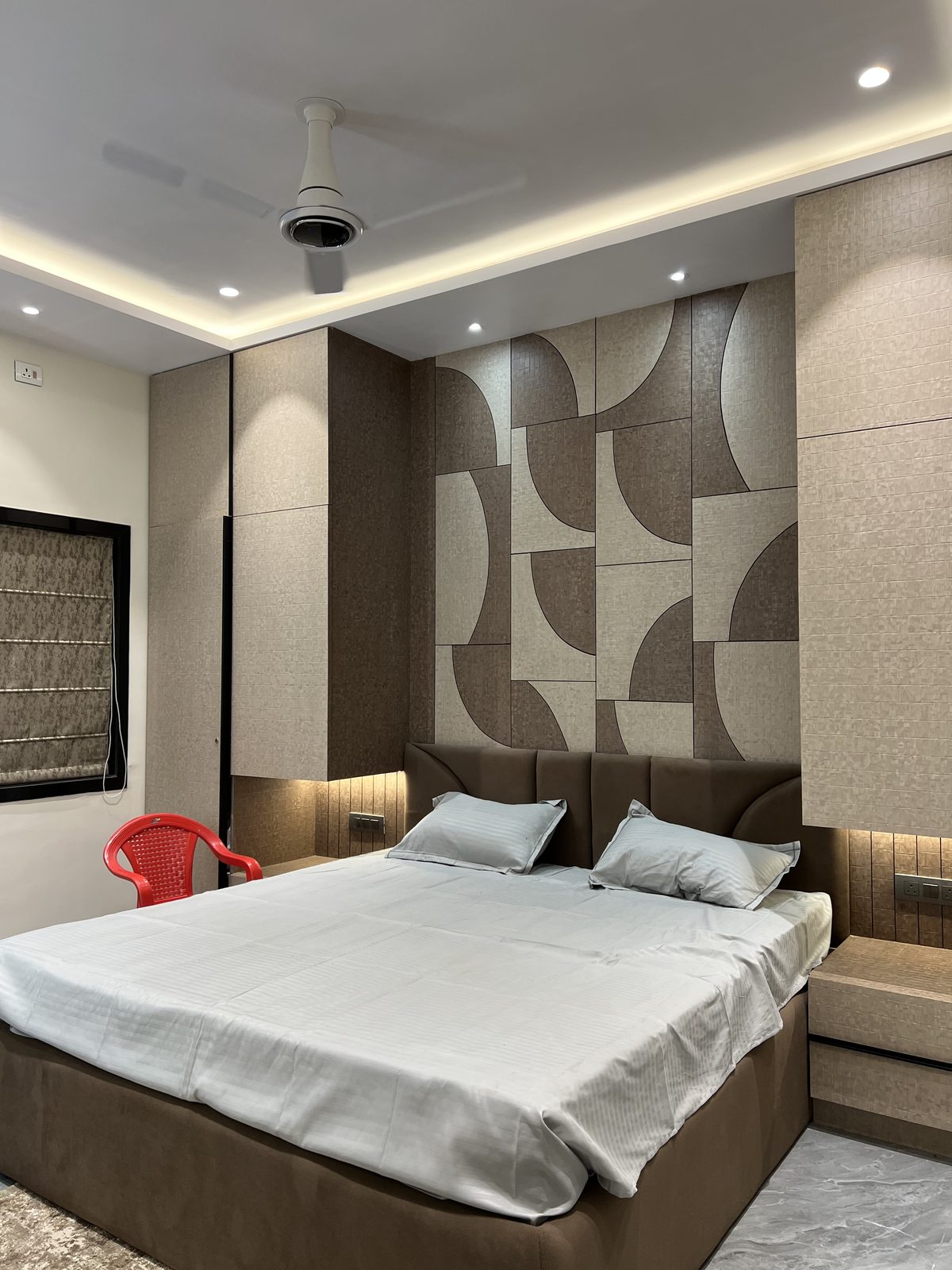 Designer bed with geometric patterned headboard panel and fitted side storage, Latur
