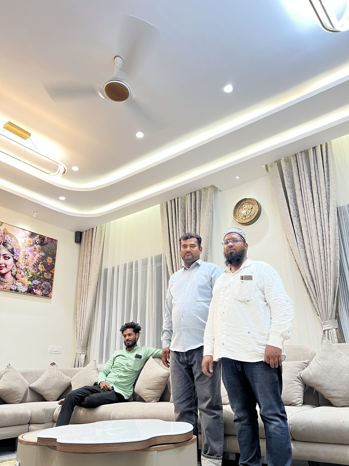 Completed living room with fabric sofa set, centre table and decorative wall art, Udgir