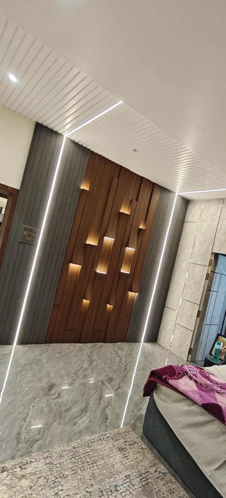 Profile door in walnut finish with vertical louvers and recessed LED light pockets, Udgir