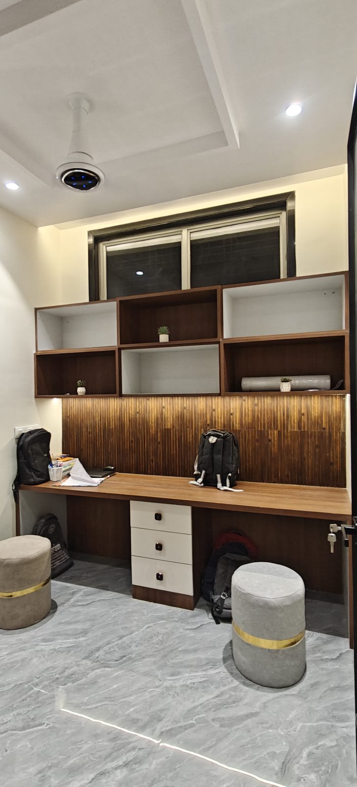 Built in study table with wooden worktop, drawer unit and overhead shelving, Udgir
