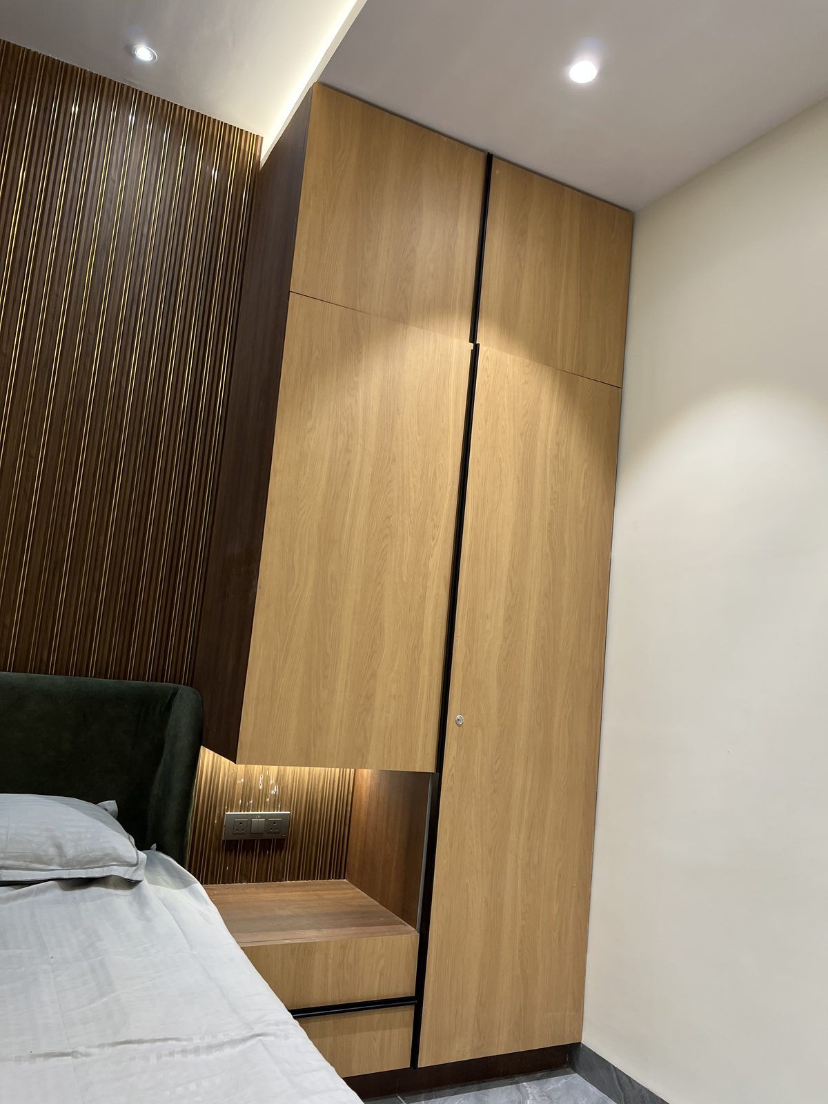 Wooden veneer wardrobe with matching bedside unit and integrated LED lighting, Latur